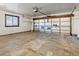 Spacious two-car garage with insulated doors, concrete floors, and a bright window at 3780 W 66Th Ave, Arvada, CO 80003