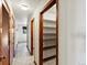 Bright hallway with tile flooring, white walls and wood trim and doors at 3780 W 66Th Ave, Arvada, CO 80003