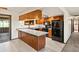 Updated kitchen featuring granite countertops, wood cabinets, and modern black appliances at 3780 W 66Th Ave, Arvada, CO 80003