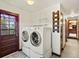 Laundry area with door to outside, shelving and hanging hooks at 3780 W 66Th Ave, Arvada, CO 80003