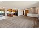 Open-concept living space with updated kitchen and spacious carpeted living area at 3780 W 66Th Ave, Arvada, CO 80003