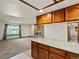 Open concept living space with kitchen and stone fireplace at 3780 W 66Th Ave, Arvada, CO 80003