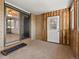 Sunroom with sliding glass doors leading into the home, brick walls, and wood paneling at 3780 W 66Th Ave, Arvada, CO 80003