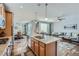 Open-concept kitchen with island flowing into the dining and living areas, creating a great entertaining space at 6268 Pike Ct # D, Arvada, CO 80403