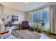 Cozy living room with hardwood floors, plants, and large windows, creating a relaxing atmosphere at 6268 Pike Ct # D, Arvada, CO 80403
