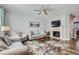 Inviting living room features comfortable seating, stylish area rug, and a fireplace with mounted TV at 6268 Pike Ct # D, Arvada, CO 80403
