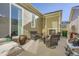 Covered patio with a fireplace, seating, and a grill, ideal for outdoor dining and relaxation at 6268 Pike Ct # D, Arvada, CO 80403