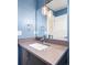 Stylish bathroom with a vessel sink, modern vanity, and decorative lighting at 3515 S Ogden St, Englewood, CO 80113