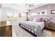 Stylish bedroom with a textured accent wall, contemporary lighting, and a plush rug at 3515 S Ogden St, Englewood, CO 80113