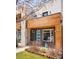 Modern home with a blue front door, gray brick, and wood accents on the facade at 3515 S Ogden St, Englewood, CO 80113
