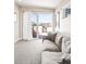 Cozy living room with sliding door to balcony and mountain views at 3515 S Ogden St, Englewood, CO 80113