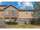 Charming home with a stone and siding exterior, and well maintained landscaping at 101 Granby Way # B, Aurora, CO 80011