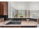 The kitchen area with a view of the open-concept living and dining spaces at 101 Granby Way # B, Aurora, CO 80011