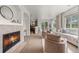 Inviting living area with fireplace, an open layout, and large windows for ample natural light at 101 Granby Way # B, Aurora, CO 80011