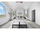Bright main bedroom with large windows, cozy benches, and elegant decor at 101 Granby Way # B, Aurora, CO 80011