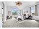 Spacious main bedroom features neutral decor, vaulted ceiling, fan, and bright windows at 101 Granby Way # B, Aurora, CO 80011