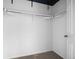 Uncluttered walk-in closet with white walls, neutral carpet, and basic hanging racks at 101 Granby Way # B, Aurora, CO 80011