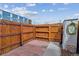 Fenced patio with brick paving and storage shed offers a private outdoor space at 1804 Grove St, Denver, CO 80204