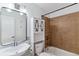 Cozy bathroom with a tiled shower, vanity with sink, and storage cabinet at 1804 Grove St, Denver, CO 80204