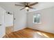 This bedroom features hardwood floors, natural light, and ceiling fan at 1804 Grove St, Denver, CO 80204