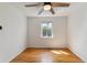 Bedroom with hardwood floors, natural light, and ceiling fan at 1804 Grove St, Denver, CO 80204