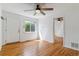 Hardwood flooring and natural light in a living room featuring a ceiling fan at 1804 Grove St, Denver, CO 80204