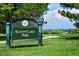 Sloan's Lake Park sign surrounded by lush greenery and a picturesque landscape view at 1804 Grove St, Denver, CO 80204