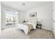 Bedroom with a sliding glass door with access to a patio, and cozy decor at 5763 N Gibralter Way # 2-108, Aurora, CO 80019