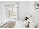 Close up of a well decorated bed, next to a sliding glass door, and a large window at 5763 N Gibralter Way # 2-108, Aurora, CO 80019