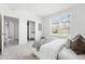Bright bedroom with a large window, an ensuite bathroom and walk-in closet at 5763 N Gibralter Way # 2-108, Aurora, CO 80019
