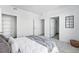 Well-lit bedroom featuring a walk-in closet and an ensuite bathroom at 5763 N Gibralter Way # 2-108, Aurora, CO 80019