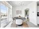 Bright dining room with a modern chandelier, large windows, and space for entertaining at 5763 N Gibralter Way # 2-108, Aurora, CO 80019
