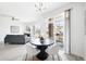 Open-concept dining area with stylish furnishings and access to a living room and large windows at 5763 N Gibralter Way # 2-108, Aurora, CO 80019