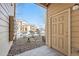 Inviting front door with small rock garden, apartment building visible in the background on a bright day at 5763 N Gibralter Way # 2-108, Aurora, CO 80019