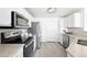 Beautiful kitchen featuring stainless appliances, granite countertops, and white cabinets at 5763 N Gibralter Way # 2-108, Aurora, CO 80019