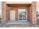 Private patio with brick columns, providing an inviting outdoor space at 5763 N Gibralter Way # 2-108, Aurora, CO 80019