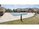 Community pool area with the pool covered, adjacent to the clubhouse and well-manicured lawns at 5763 N Gibralter Way # 2-108, Aurora, CO 80019