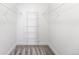 Walk-in closet with wire shelving provides ample storage space and functional carpet flooring at 5763 N Gibralter Way # 2-108, Aurora, CO 80019