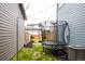 Backyard featuring a trampoline, green grass, and patio furniture at 10025 E 63Rd Ave, Denver, CO 80238