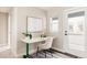 Bright office space with a clean desk, neutral decor, and access to a private deck at 10025 E 63Rd Ave, Denver, CO 80238