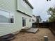 Backyard exterior with siding and concrete patio at 20861 E 40Th Ave, Denver, CO 80249