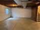 Unfinished basement space with concrete floors, open ceiling, and a window for natural light at 20861 E 40Th Ave, Denver, CO 80249