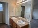 Bathroom featuring a double-sink vanity with ample counter space and a large mirror at 20861 E 40Th Ave, Denver, CO 80249