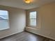 Bedroom with hardwood floors and two windows letting in natural light, offering comfortable space at 20861 E 40Th Ave, Denver, CO 80249