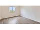 Bedroom featuring wood-style flooring and natural light from a window at 20861 E 40Th Ave, Denver, CO 80249