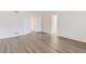 Spacious bedroom with neutral paint and wood-style flooring at 20861 E 40Th Ave, Denver, CO 80249