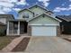 Charming two-story home with a two-car garage and inviting front porch at 20861 E 40Th Ave, Denver, CO 80249