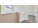 Hallway with wood floors, natural light, and access to rooms at 20861 E 40Th Ave, Denver, CO 80249