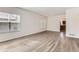 Bright and open living space featuring hardwood floors, large windows, and an open view of the kitchen at 20861 E 40Th Ave, Denver, CO 80249