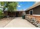 View of the backyard featuring a detached garage and a pile of firewood at 11433 Carlile St, Northglenn, CO 80233